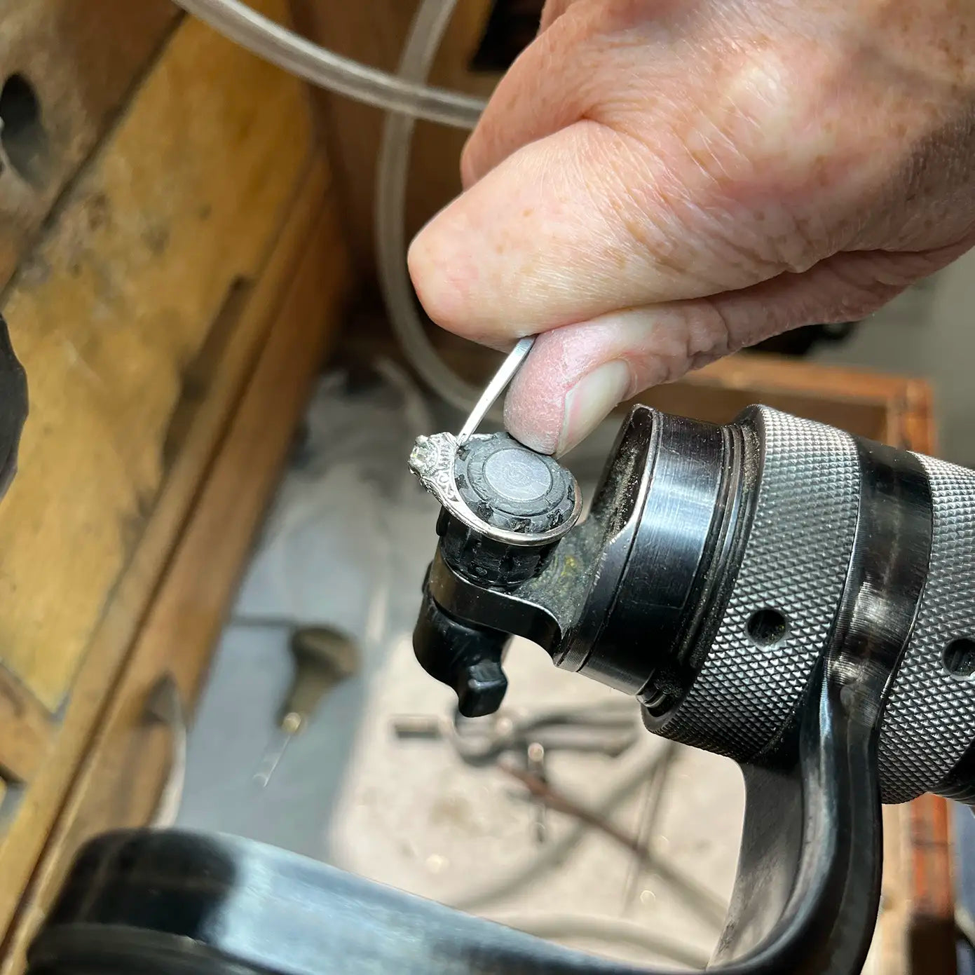 JosephK Jewelers employee working on a diamond ring