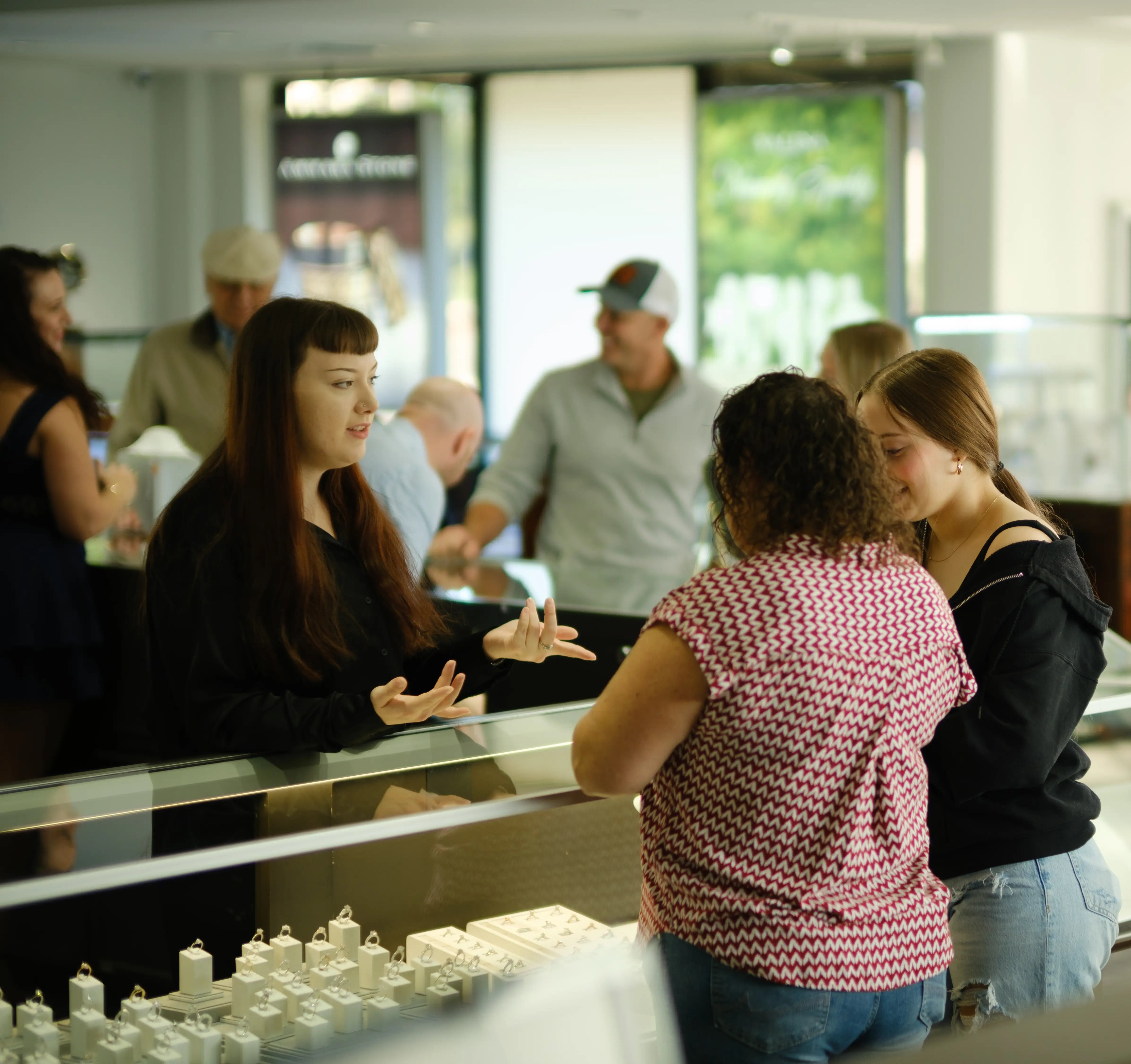 JosephK Jewelers sales associate helping customers