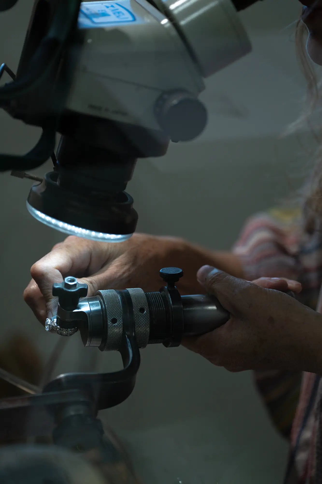 JosephK associate servicing a diamond ring