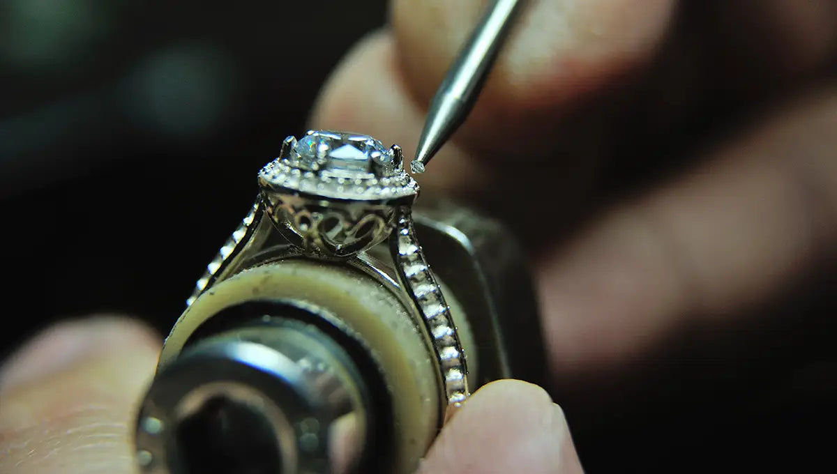 a jeweler servicing stones on a diamond ring at JosephK Jewelers in Portland, OR